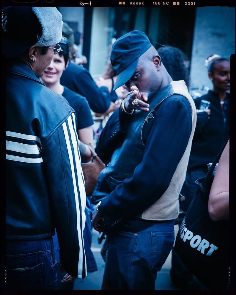 Guests in varsity and denim jackets at the Timberland × Rezet evening event, photographed on film.